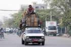 heavily loaded car people sitting on the roof sbwa8v2098_small.jpg